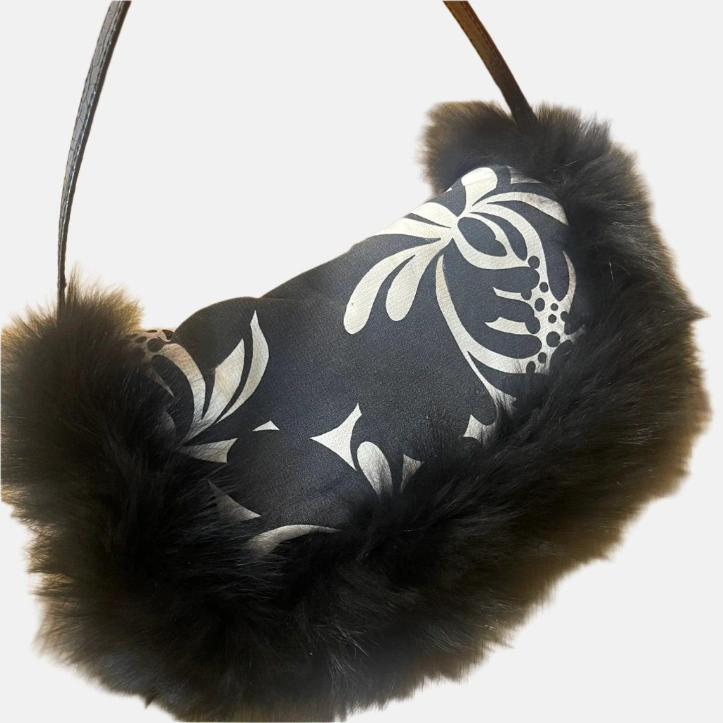 Fendi Baguette Black Print Fabric and Furry Shoulder Bag
 These are professional photos of the actual bag offered by Luxbags.
 This exquisite Fendi Baguette is crafted from printed black and white fabric, lined with furry trims. It gives off the
