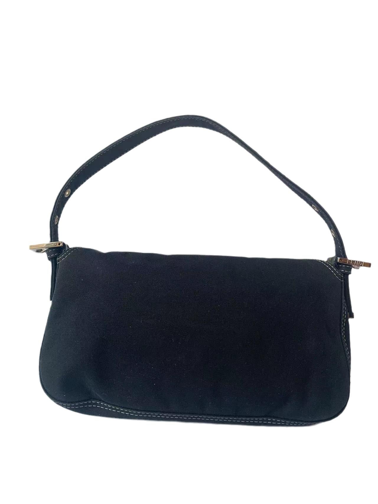 FENDI Baguette Blue Denim Navy Shoulder Bag with Enamel Buckle
These are professional photos of the actual bag.
  Fendi baguette denim in navy color with silver hardware and enamal buckle. The enamel is broken at some places. 
  CONDITION: VERY