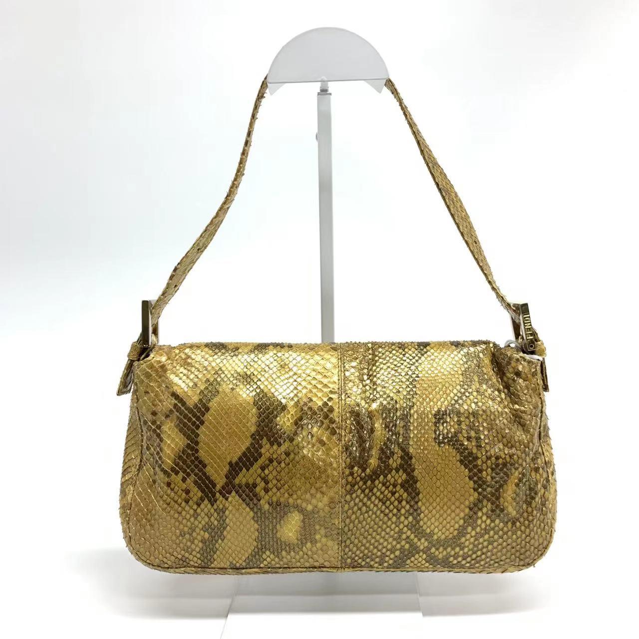Fendi Baguette Brown Python Leather Snake Print
 These are professional photos of the actual bag offered by Luxbags.
 Fendi Baguette Brown Python Leather with Snake Print. This designer bag is the perfect combination of sophisticated style and