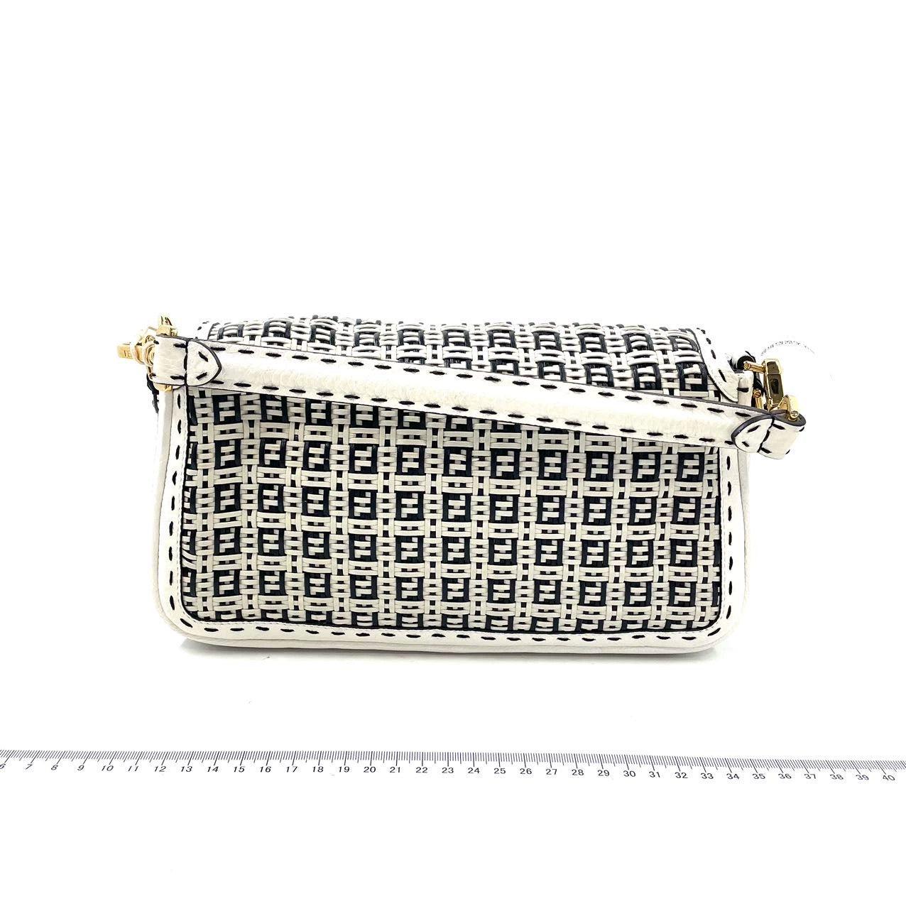 Fendi Baguette Calfskin Leather Weave Black and White Crossbody Bag
  These are professional photos of the actual bag offered by Luxbags.
  Experience luxury and style with the Fendi Baguette Crossbody Bag. Crafted from calfskin leather with
