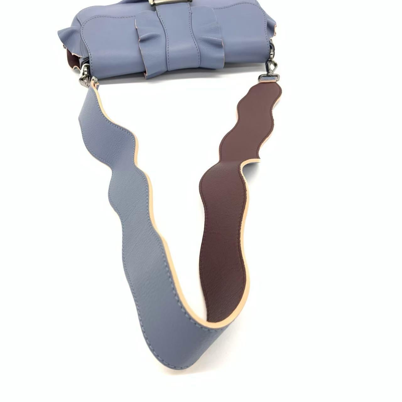 Fendi Baguette Calfskin Waves Baguette Blue Crossbody Bag
These are professional photos of the actual bag.
EXCELLENT: EXCELLENT
DETAILS


Model: Fendi Baguette


Size: Medium


Exterior Material: Calfskin Leather


Exterior Color: Blue


Strap