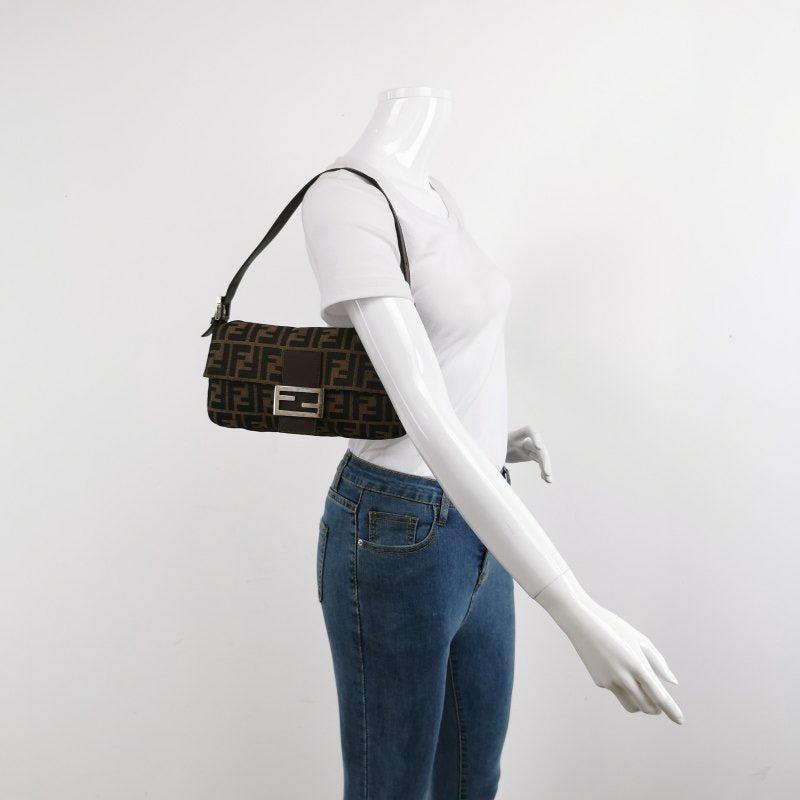 Fendi Baguette Classic Zucca Print Fendi Monogram
 These are professional photos of the actual bag.
 Introducing the Fendi Baguette, a classic icon featuring the beloved Zucca print. This vintage brown shoulder bag is a must-have for fashion lovers,