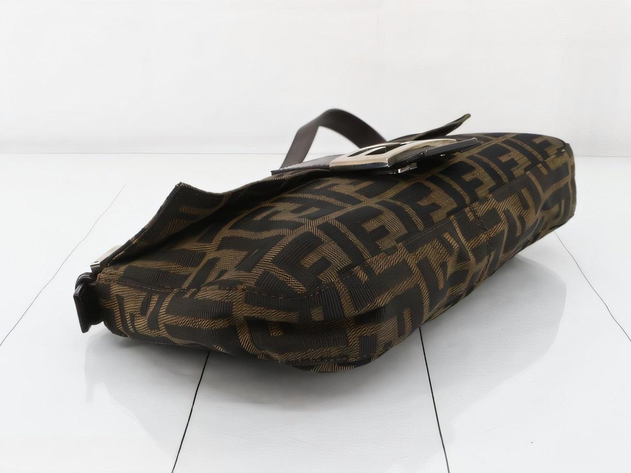 Fendi Baguette Classic Zucca Print Fendi Monogram
 These are professional photos of the actual bag offered by Luxbags.
 Introducing the Fendi Baguette, a classic icon featuring the beloved Zucca print. This vintage brown shoulder bag is a must-have