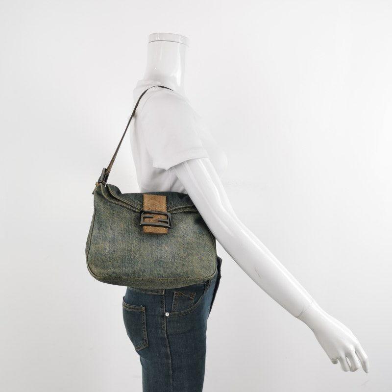 Fendi Baguette Denim Shoulder Bag Snake-skin Strap
These are professional photos of the actual bag.
  CONDITION: GOOD CONDITION
  Moderate signs of wear. Light stains throughout. 
  DETAILS
  
  Fendi
  Baguette
  Denim, Snake-skin
  
  Width 25cm x