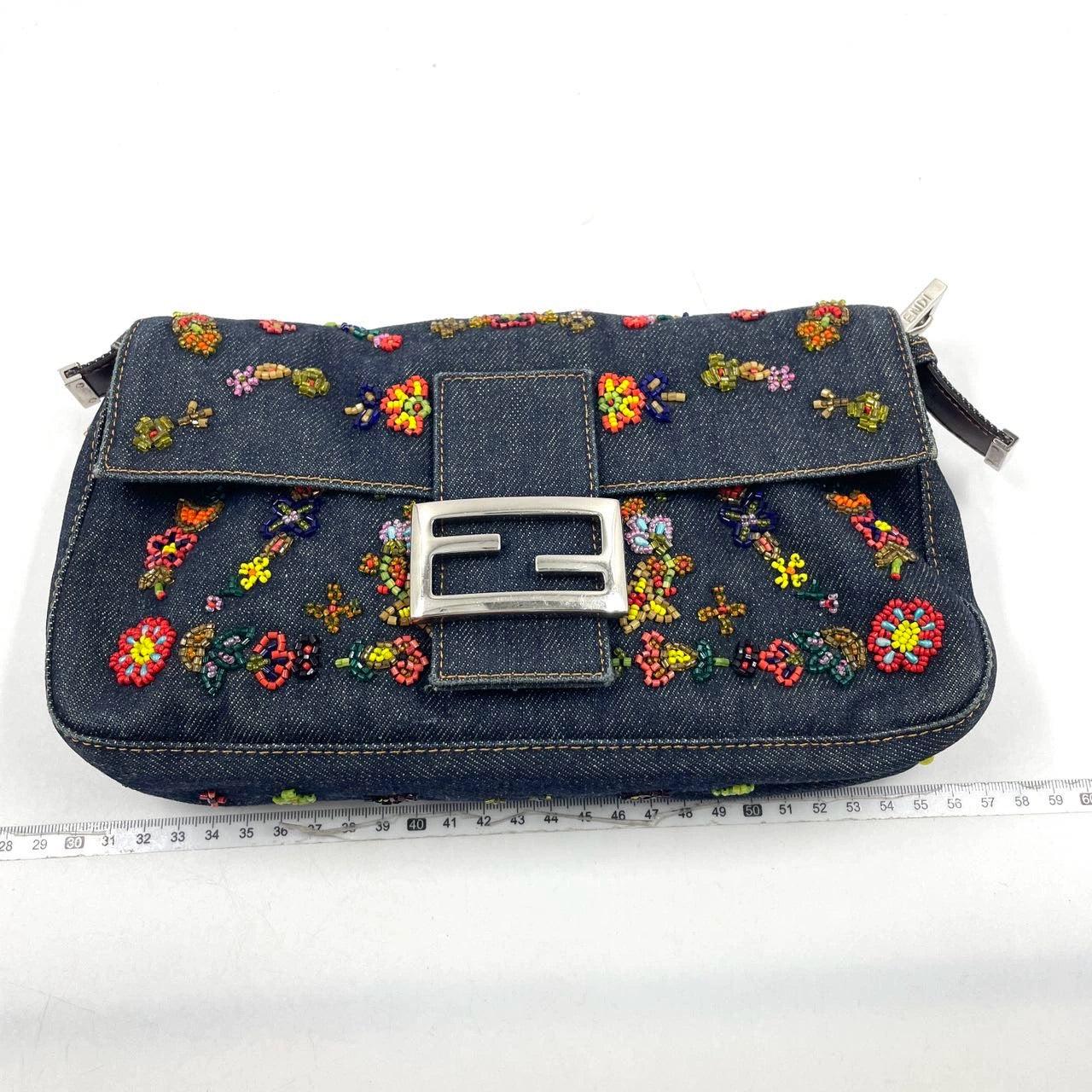 Fendi Baguette Denim with Floral Beads 25 Anniversary Special Collection
These are professional photos of the actual bag.
  CONDITION: EXCELLENT
  There may be light stains on the interior, scratches to the hardware. A couple of beads may have