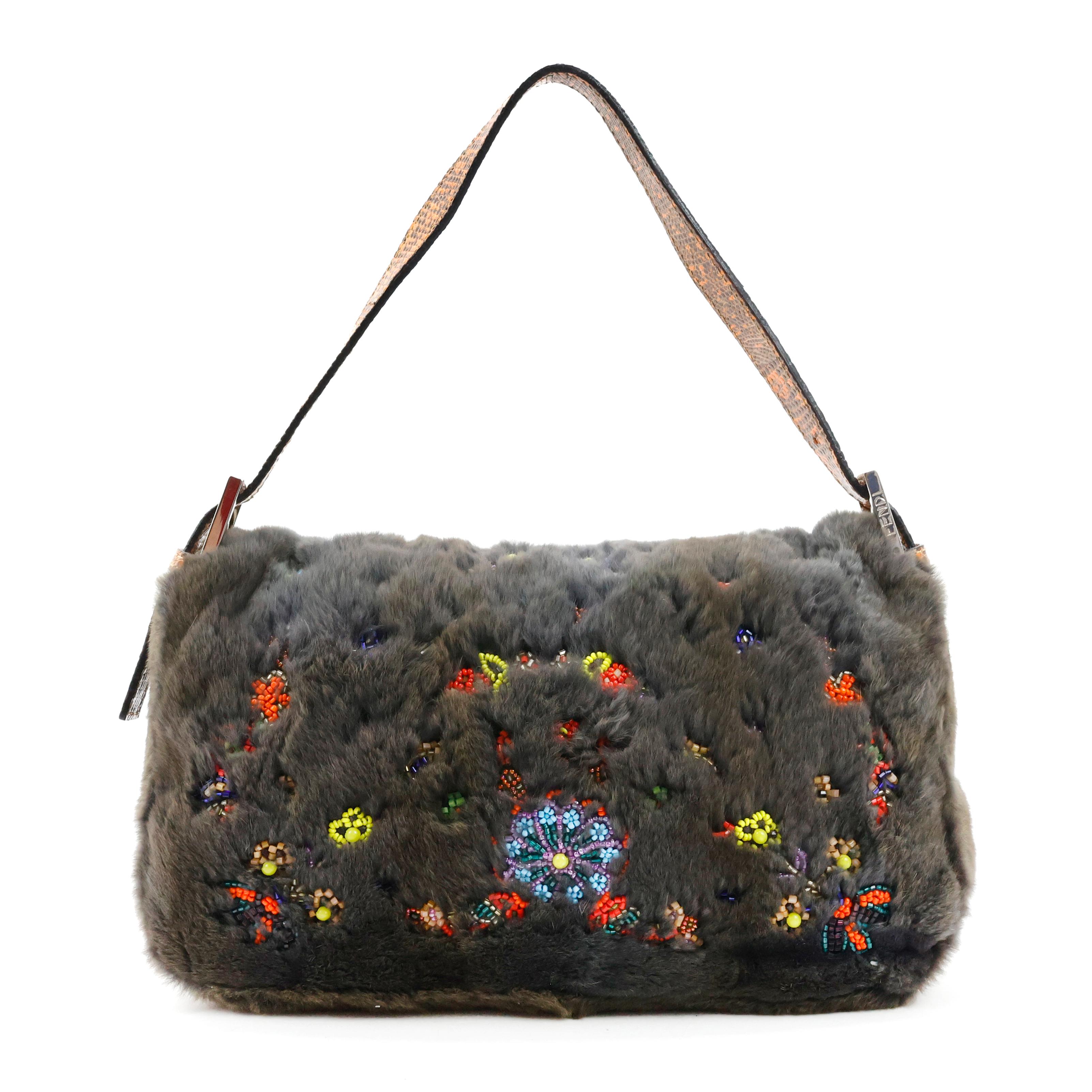 Rare Fendi baguette in fur color grey + python leather color orange, with embroidered multicolored mini stones, internal in silk color orange, silver hardware. Collector piece.

Condition:
Really good, to note: slight scratches on front