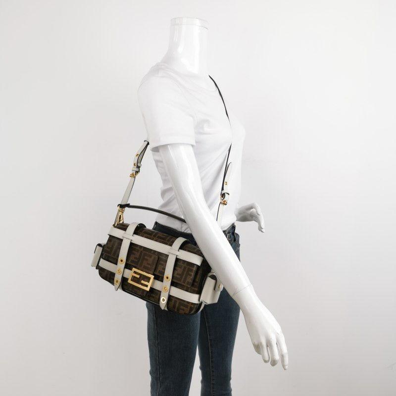 Fendi Baguette Glazed Fabric Vitello Century FF 1974 Large Baguette Cage Mogano Panna White Ice
  These are professional photos of the actual bag offered by Luxbags.
  Carry it by hand, on the shoulder, or across the body for versatile use.