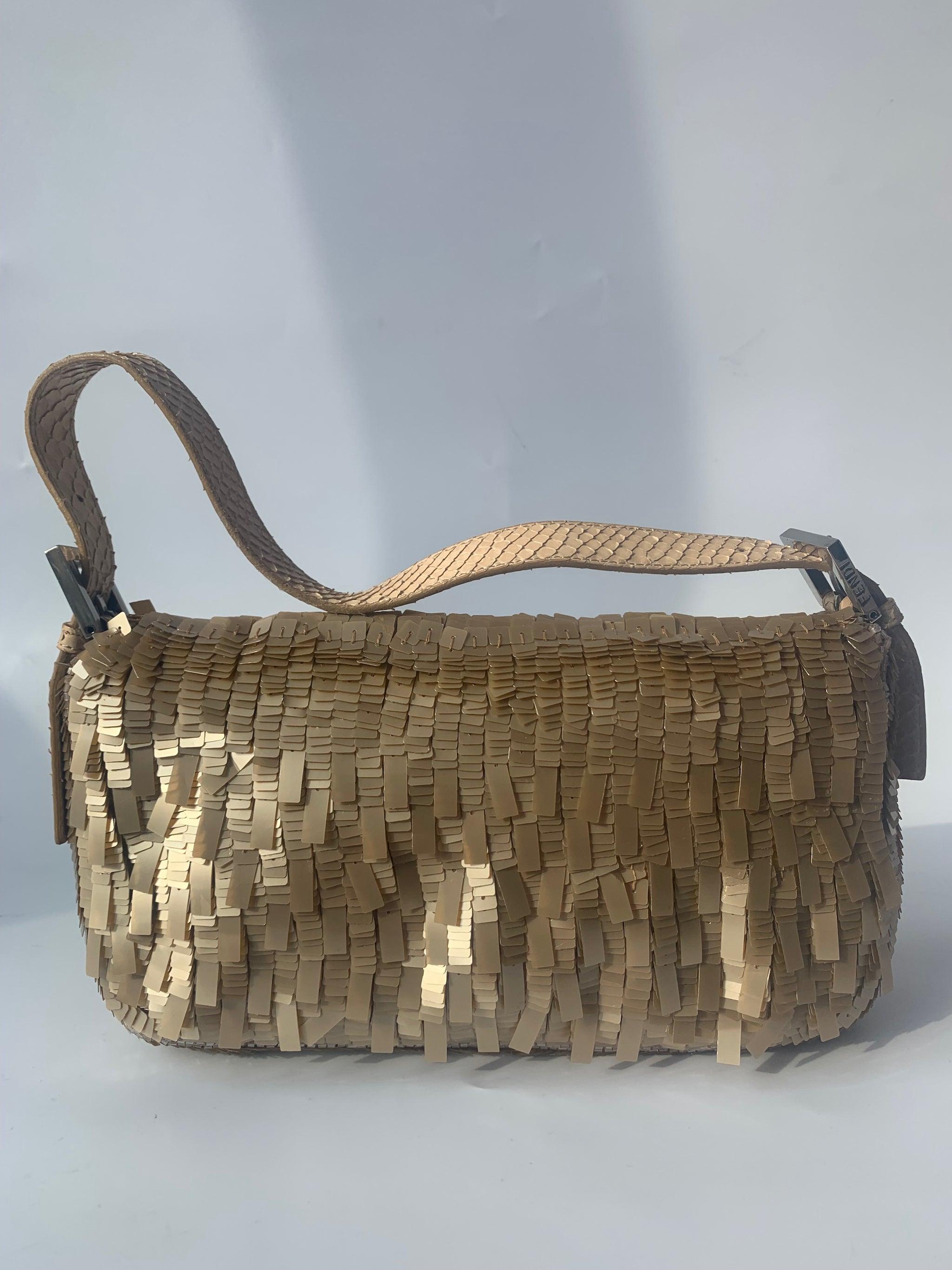 Fendi Baguette in Gold sequins and python leather
 These are professional photos of the actual bag offered by Luxbags.
 This Fendi Baguette definitely stands out from the crowd. Crafted with shimmering gold sequins and python leather, it sparkles