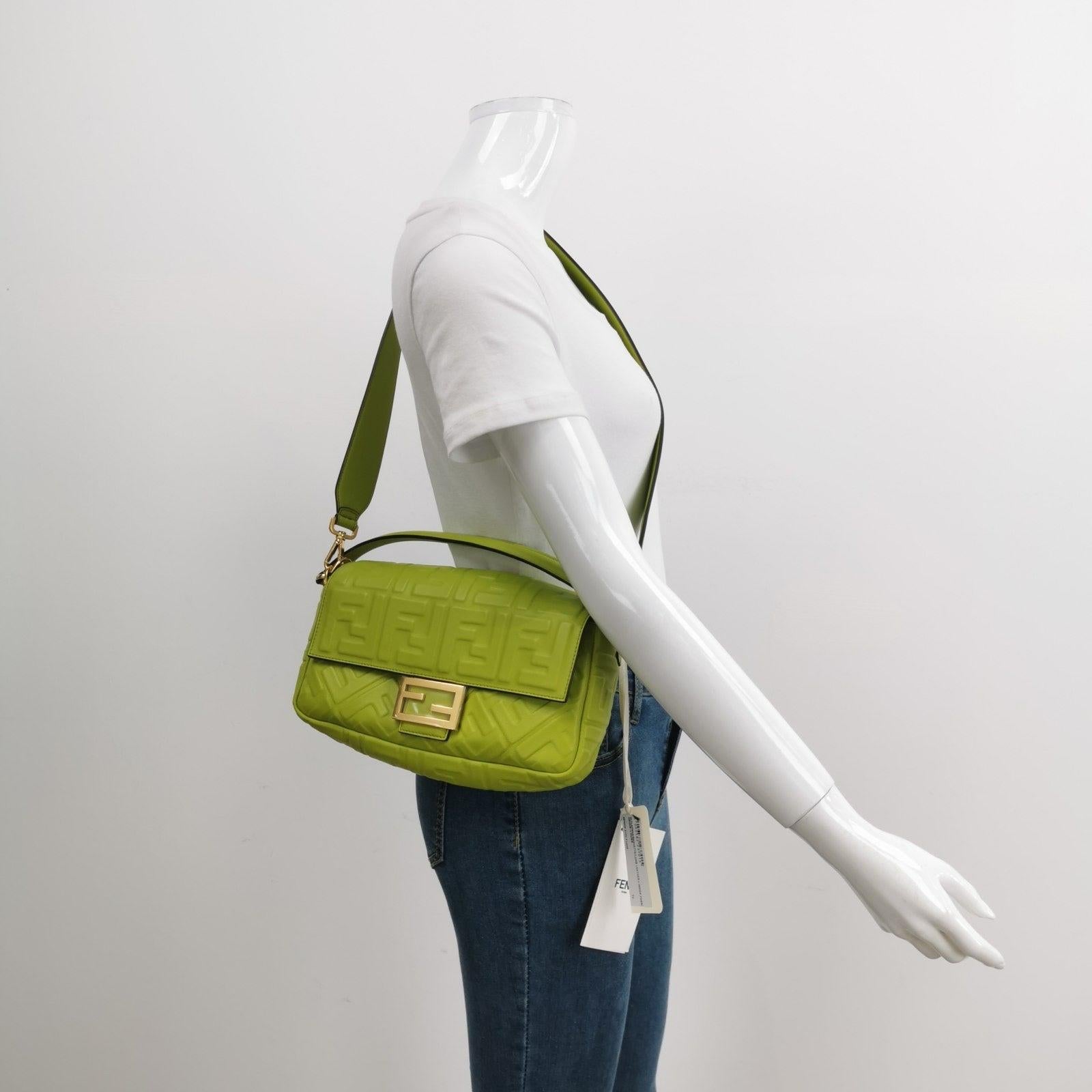 Fendi Baguette Lambskin Leather Crossbody Bag Medium Lime Green

Experience luxury and style with the Fendi Baguette in luxuriously Nappa Leather Crossbody Bag. Crafted from soft nappa leather with intricate 3D FF motif embossing, this incredibly