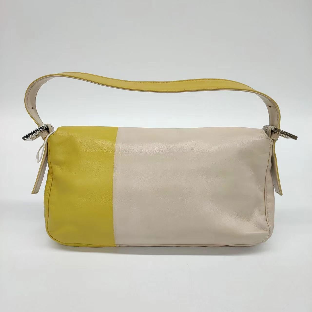 Fendi Baguette Lambskin Leather Shoulder Bag Beige Yellow
 These are professional photos of the actual bag offered by Luxbags.
 
 FENDI Baguette Lambskin Leather is a classic, go-to accessory. Its buttery soft leather is incredibly light, making it