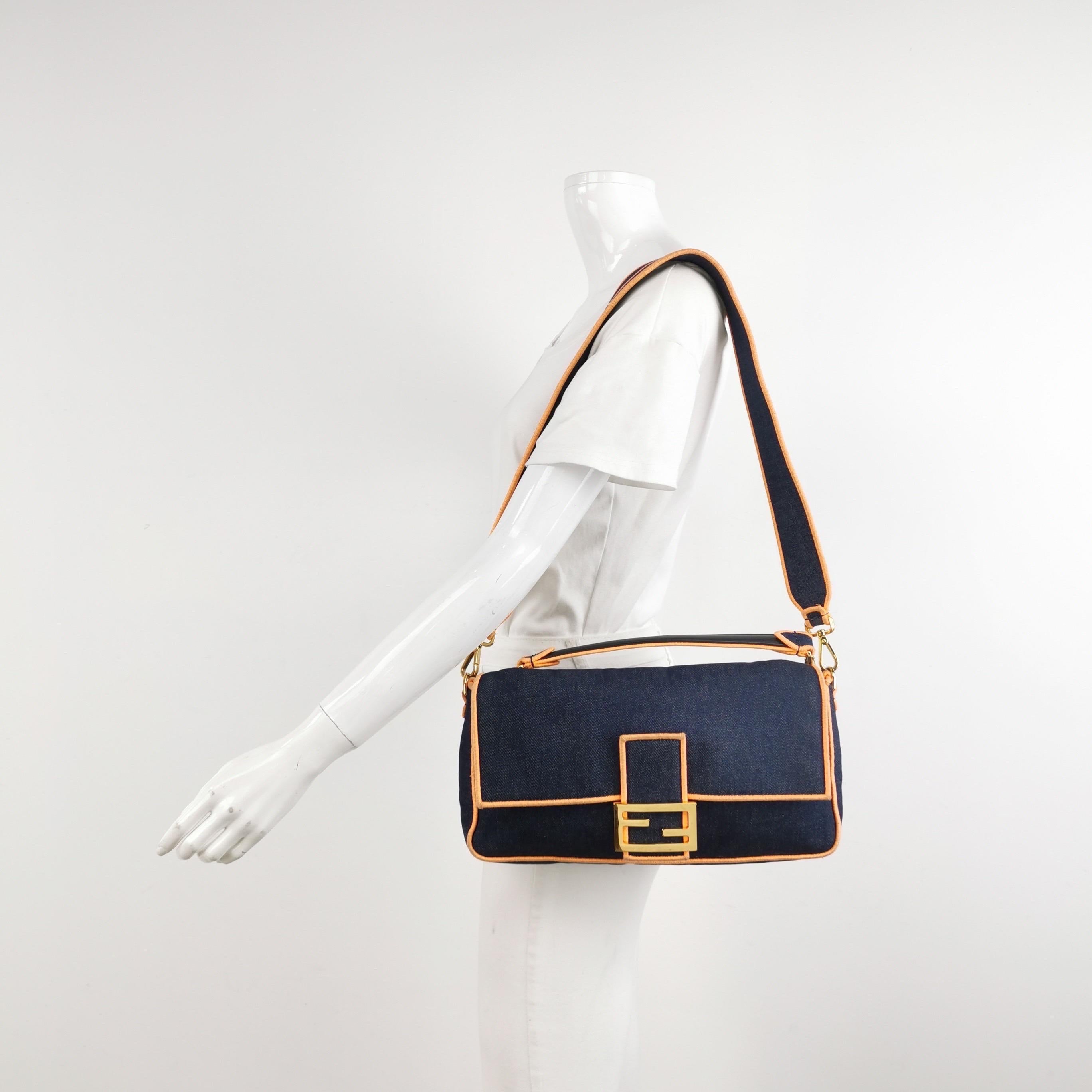 Fendi Baguette in Brown Zucca print canvas with electrifying neon color trimming. 

CONDITION: EXCELLENT

Light rubbing around the corners. Light stains on the exterior and interior. Scratches to the hardware. 

DETAILS

Fendi
Baguette
Material: