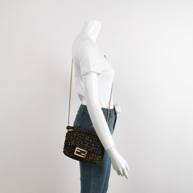 Fendi Baguette Mini Canvas Crochet Zucca Dark Green and Gold Hardware
  These are professional photos of the actual bag offered by Luxbags.
  Carry it by hand, on the shoulder, or across the body for versatile use. Featuring a top flap with magnetic
