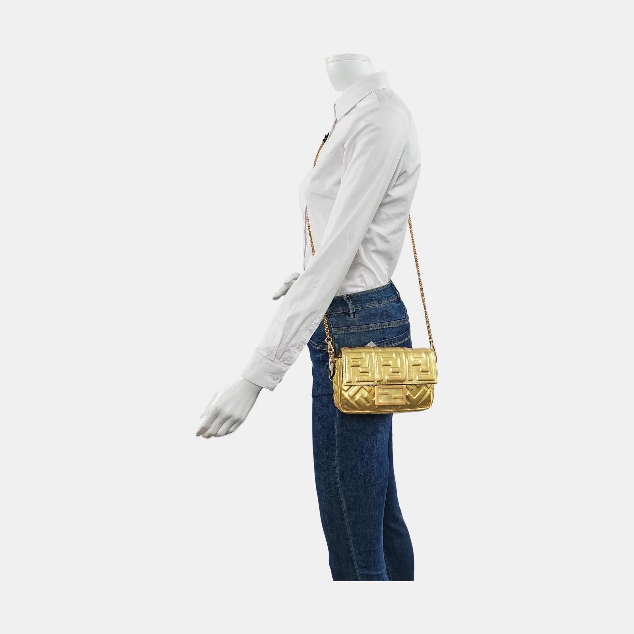 Fendi Baguette Mini Gold Nappa Leather Crossbody Bag These are professional photos of the actual bag offered by Luxbags. Experience luxury and style with the Fendi Baguette Mini Gold Nappa Leather Crossbody Bag. Crafted from soft nappa leather with