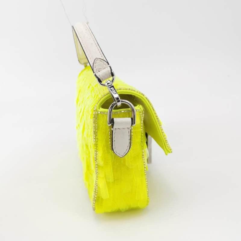 Fendi Baguette Mini Neon Lime Green Sequins Chain Strap Crossbody Bag
These are professional photos of the actual bag.
  Experience luxury and style with the Fendi Baguette Mini Crossbody Bag, adorned with neon green sequins and complimented with a