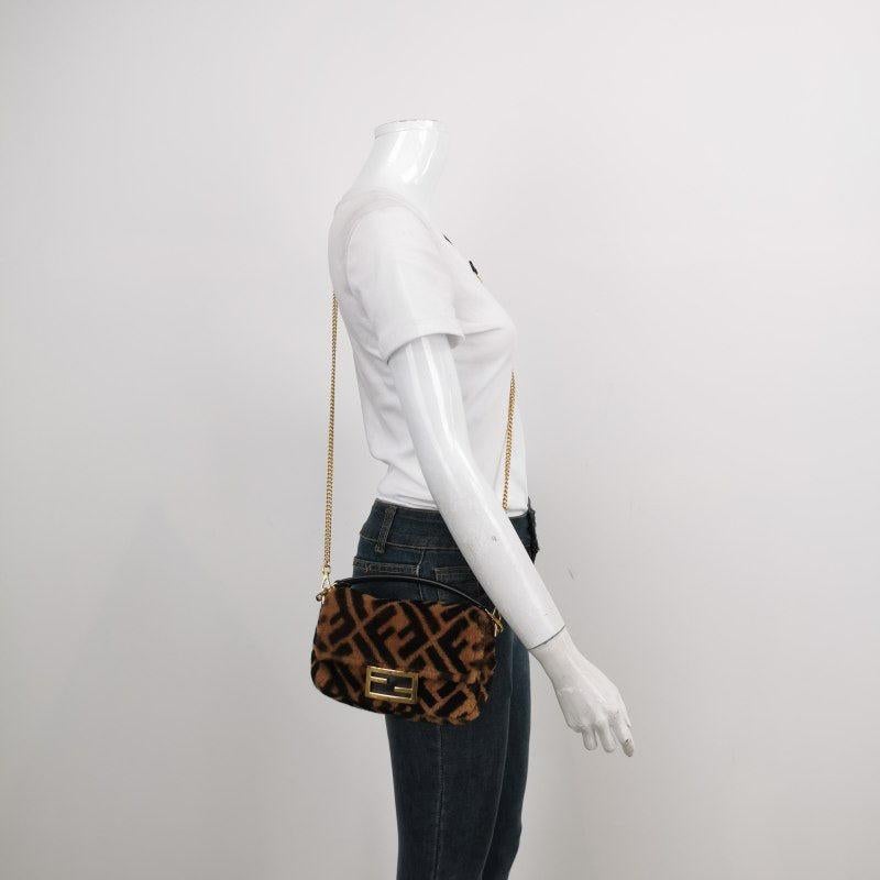 Fendi Baguette Mini Shearling Vitello Dolce Marco FF 1974 Tobacco Black Brown Zucca
 These are professional photos of the actual bag.
 Carry it by hand, on the shoulder, or across the body for versatile use. Featuring a top flap with magnetic