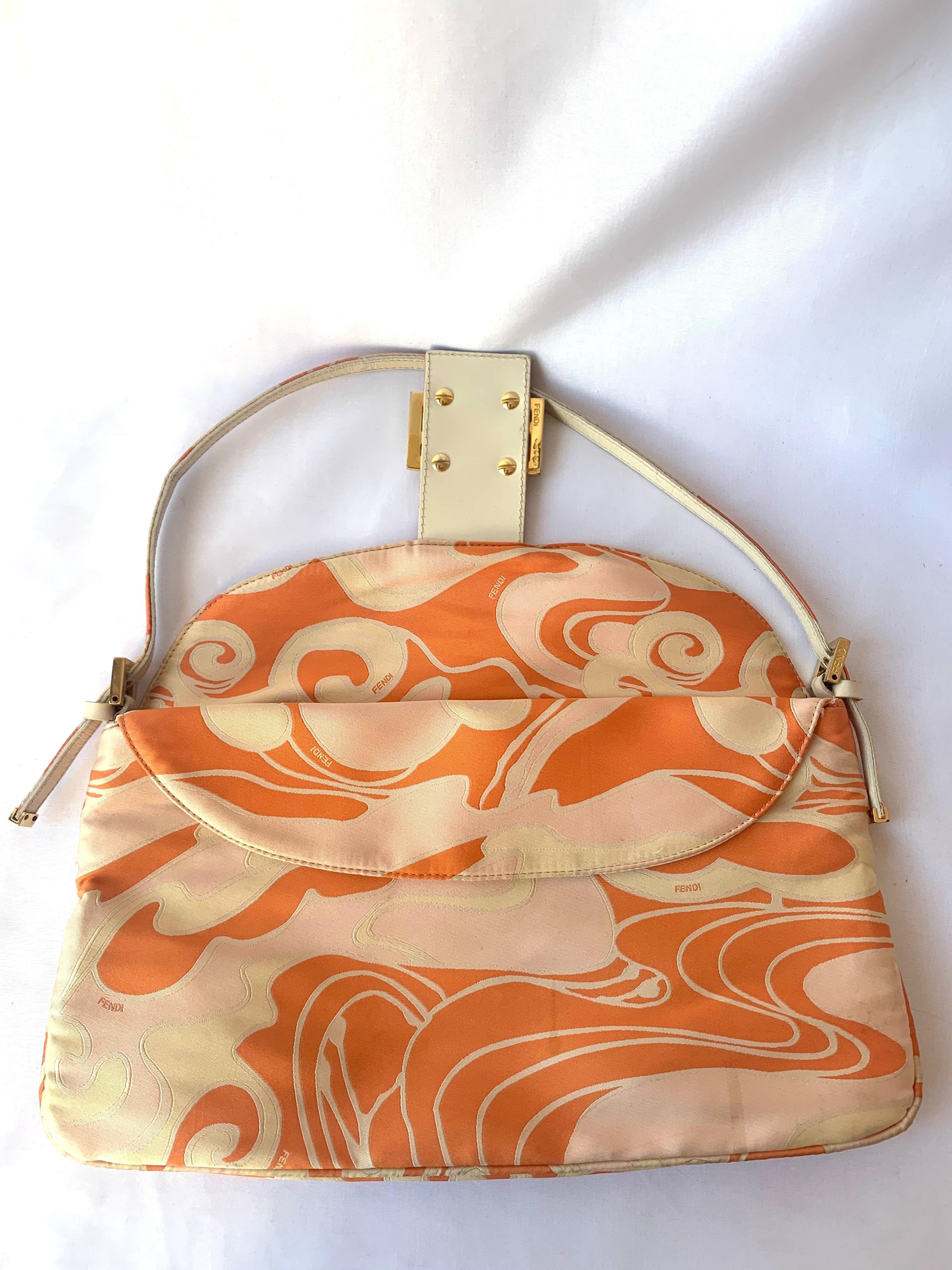 FENDI Baguette Orange Multicolor Silk with Psychedelic prints
 These are professional photos of the actual bag offered by Luxbags.
 Introducing the timelessly elegant FENDI Baguette in Multicolor Silk with Psychedelic prints! this classic piece is