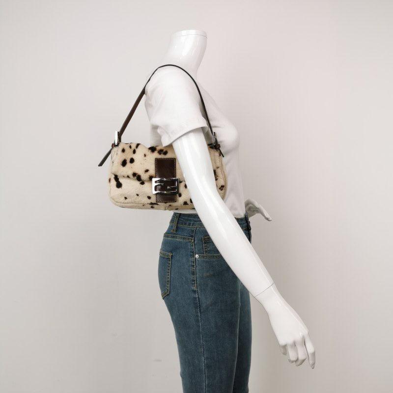 Fendi Baguette Pony-style Leather Dalmatian Print Cream White
 These are professional photos of the actual bag.
 Get ahead of the fashion curve with the Fendi Baguette Pony hair shoulder bag in leopard print. Made with high-quality ponyhair and
