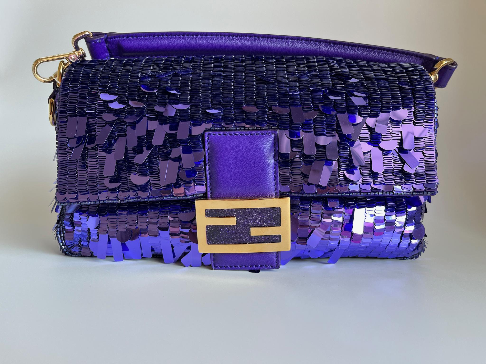 A bag that needs no introduction. Sex and City Fendi Baguette in purple sequins. Comes with strap, card, dustbag, spare sequins.

Never worn
Model: Fendi Baguette
Color: Purple
Outer Material: Sequins
Inner Material: Yellow Satin lining
Strap Color: