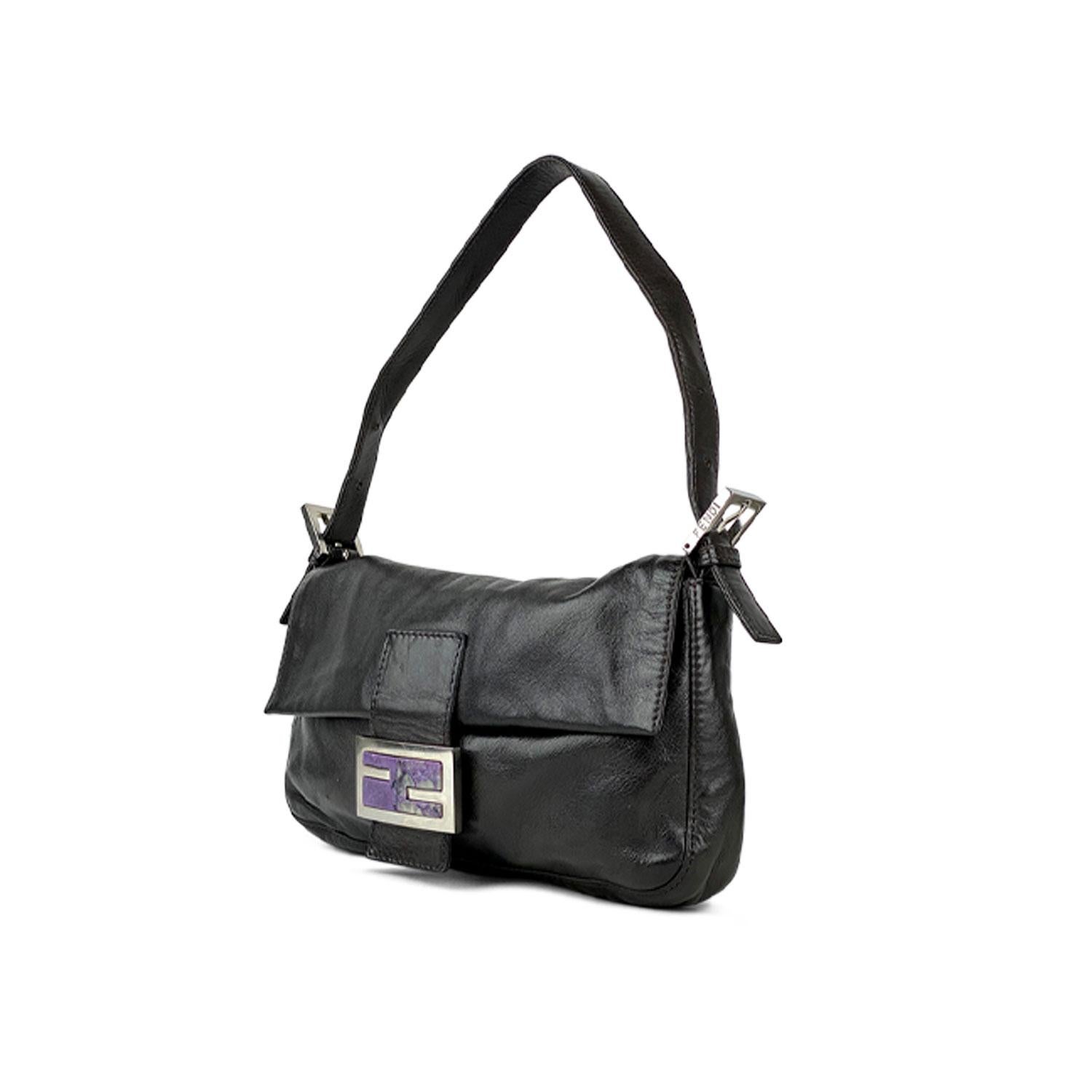Dark Brown Nappa leather Fendi Baguette with

- Silver-tone hardware
- Single flat leather shoulder strap
- Purple suede interior lining
- Single zip pocket at interior wall and magnetic snap closure at front flap featuring logo adornment

Overall