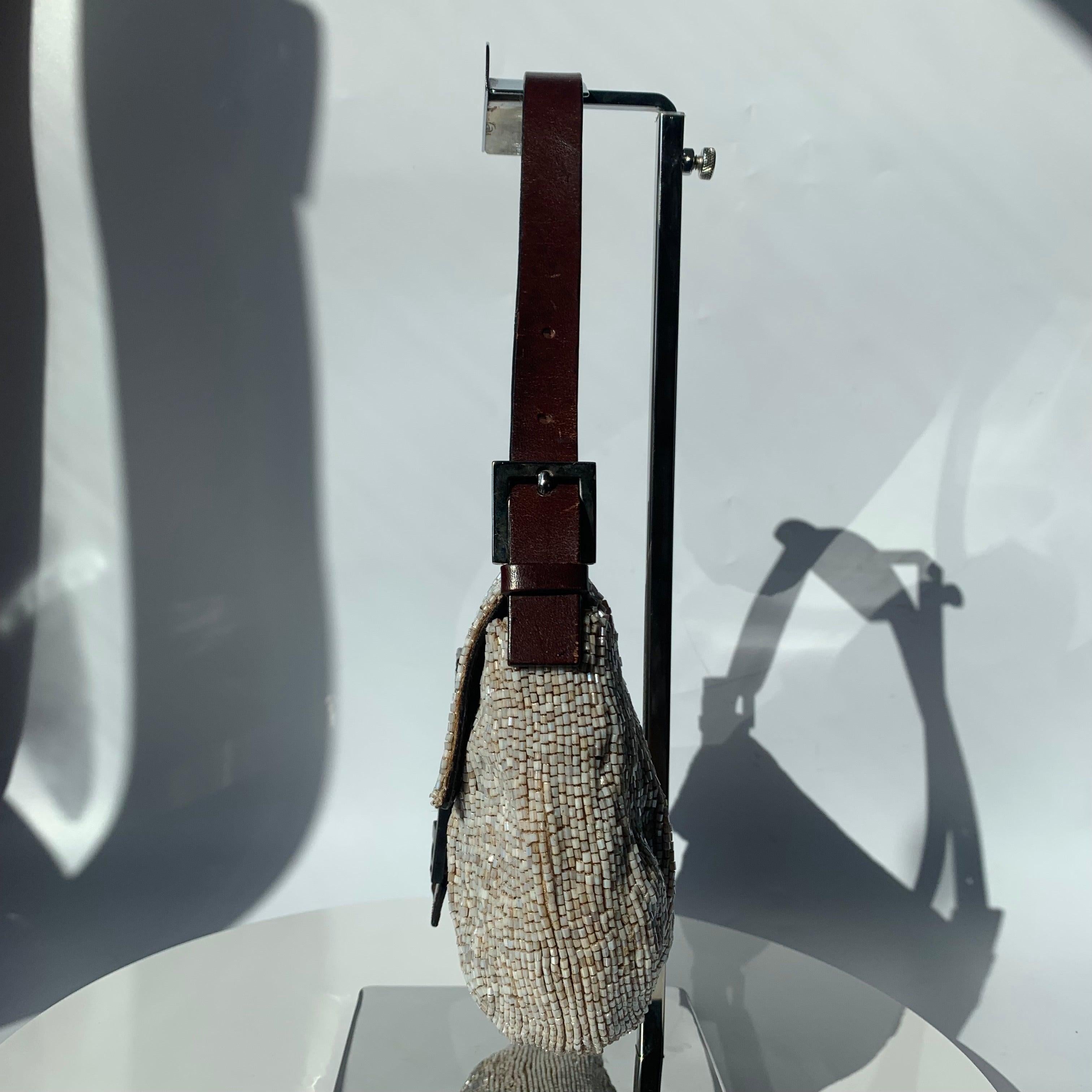 Fendi Baguette Shoulder bag with Beige Beads
 These are professional photos of the actual bag offered by Luxbags.
 Fendi Baguette Shoulder bag with Beige Color beads embellishment.
 Overall in very good condition. 
 Model: Fendi Baguette;Color: