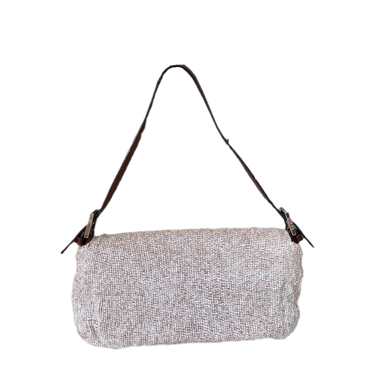 Fendi Baguette Shoulder bag with Cream Beads
 These are professional photos of the actual bag offered by Luxbags.
 Fendi Baguette Shoulder bag with cream beads embellishment.
 Overall in very good condition.