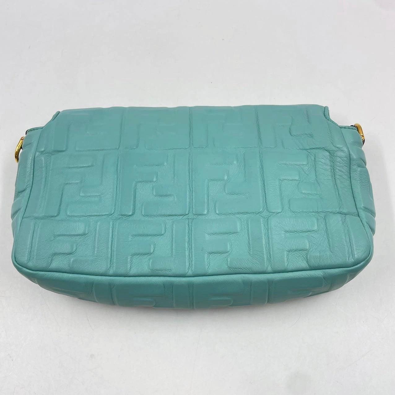 FENDI Baguette Turquoise Leather 3D FF Motif Crossbody bag
 These are professional photos of the actual bag offered by Luxbags.
 
 Iconic medium Baguette bag made of this stunning turquoise color soft nappa leather with a three-dimensional texture