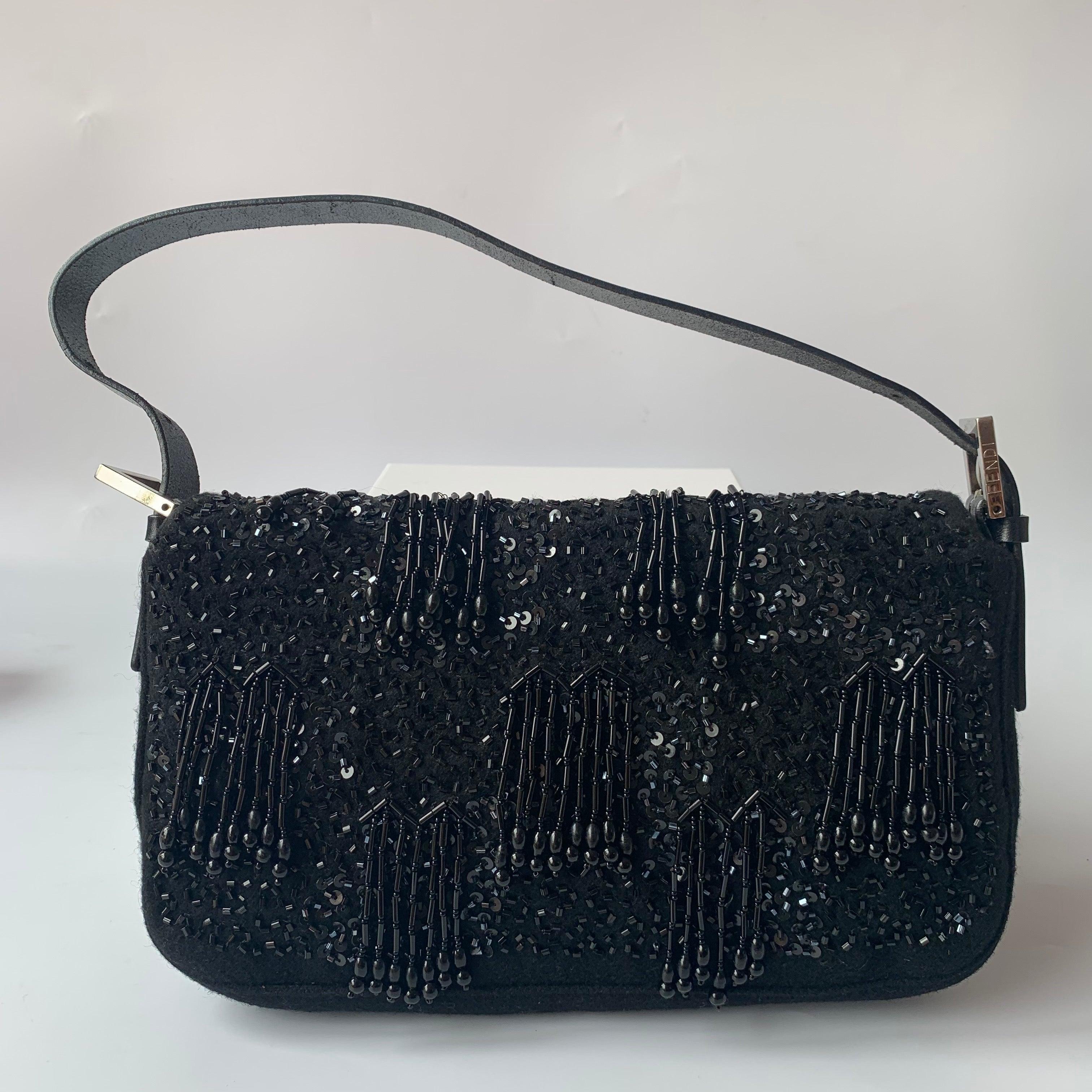 Fendi Baguette Vintage Black Beaded Tussle On Black Shoulder Bag
These are professional photos of the actual bag.
  A masterfully crafted, iconic design enhanced with intricately beaded tussle. This exquisite piece of art is versatile and can