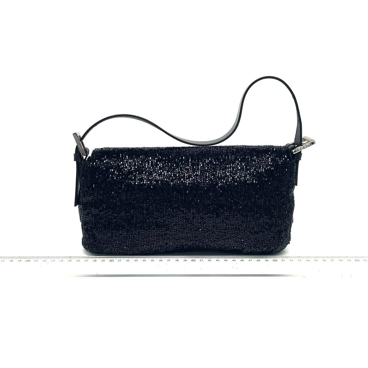 Fendi Baguette Vintage Black Glitter Beads Shoulder Bag
 These are professional photos of the actual bag offered
 Discover the Fendi Baguette Vintage Black Glitter Beads - a masterfully crafted, iconic design enhanced with shimmering beads. This