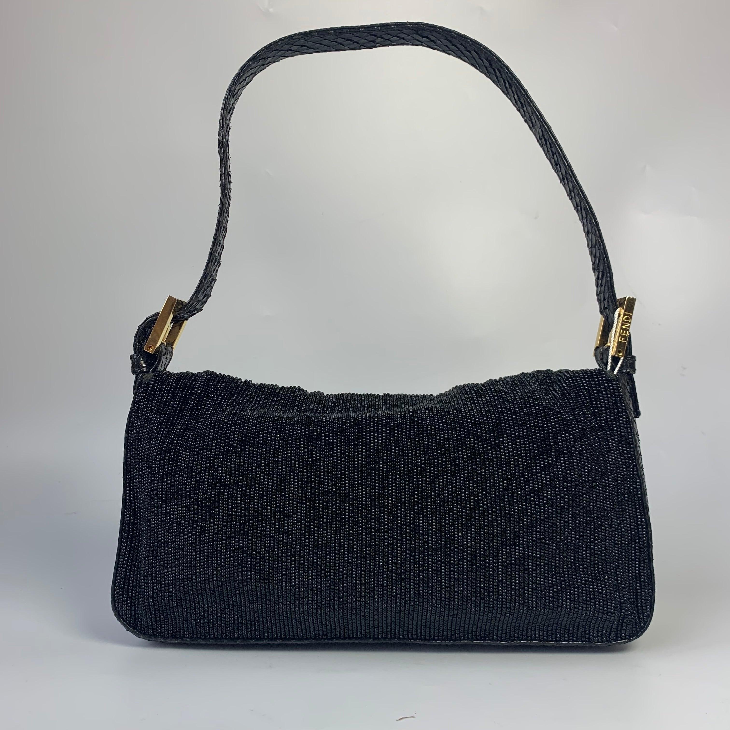 Fendi Baguette Vintage Black Round Beads with Snake Skin Strap
These are professional photos of the actual bag.
  Discover the Fendi Baguette Vintage fully adorned with Black Round Beads - a masterfully crafted, iconic design enhanced with
