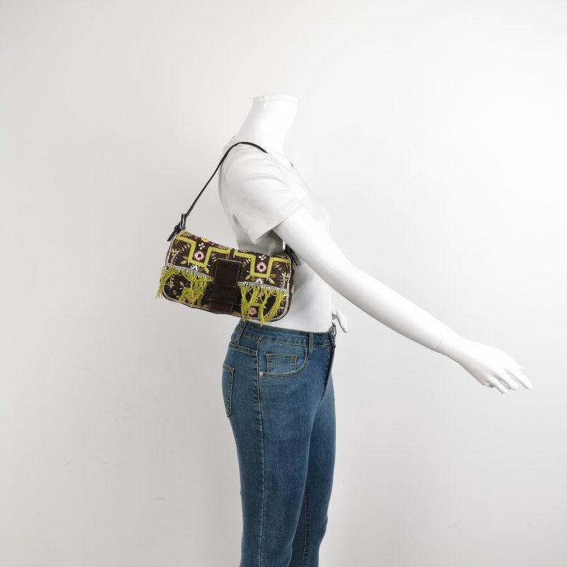 Fendi Baguette Vintage Brown Canvas with embroidery sequins mirrors and tassels
 These are professional photos of the actual bag offered by Luxbags.
 This rare vintage Fendi Baguette is made of Brown Canvas/cotton material, adored with pink and