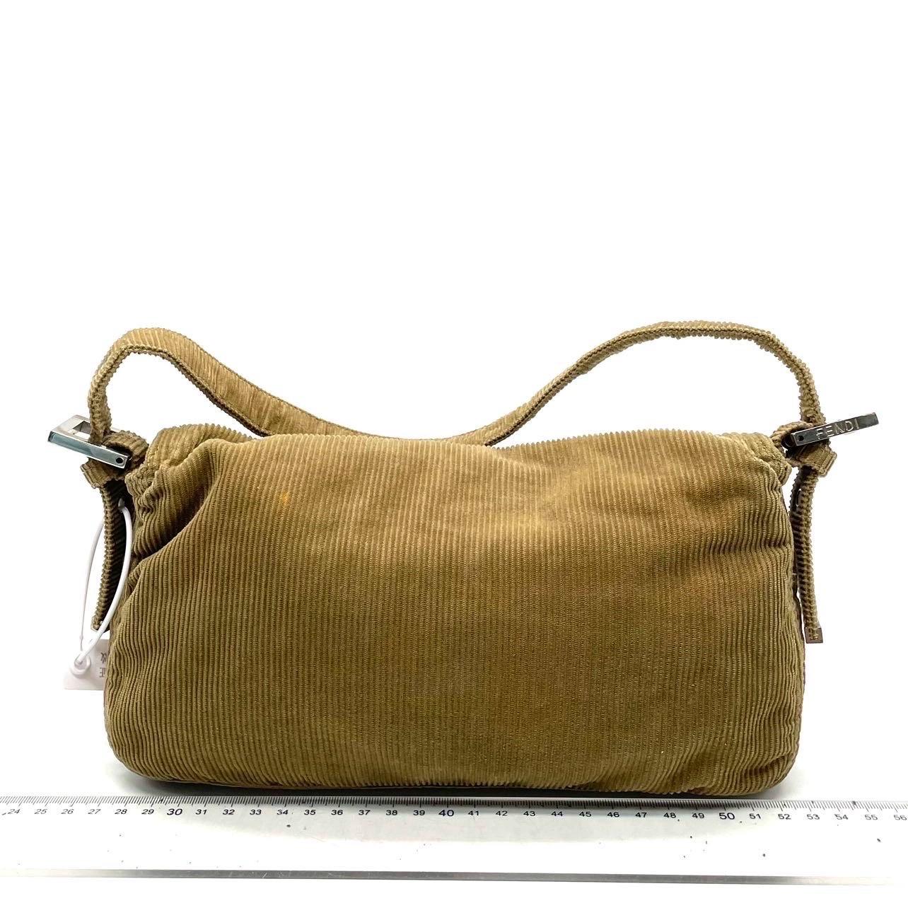 CONDITION: VERY GOOD

Rubbing around corners. Light stains inside and out. Scratches to hardware. 

DETAILS

FENDI
Baguette
Material: Corduroy
Color: Brown
Hardware color: Silver