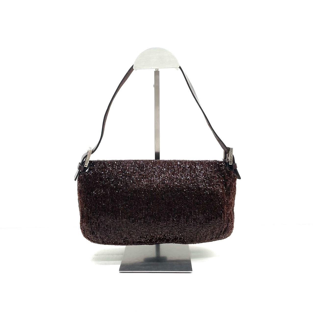 Fendi Baguette Vintage Dark Chocolate Brown Glitter Beads

  Discover the Fendi Baguette Vintage Chocolate Brown Glitter Beads - a masterfully crafted, iconic design enhanced with shimmering beads. This exquisite piece of art is versatile and can