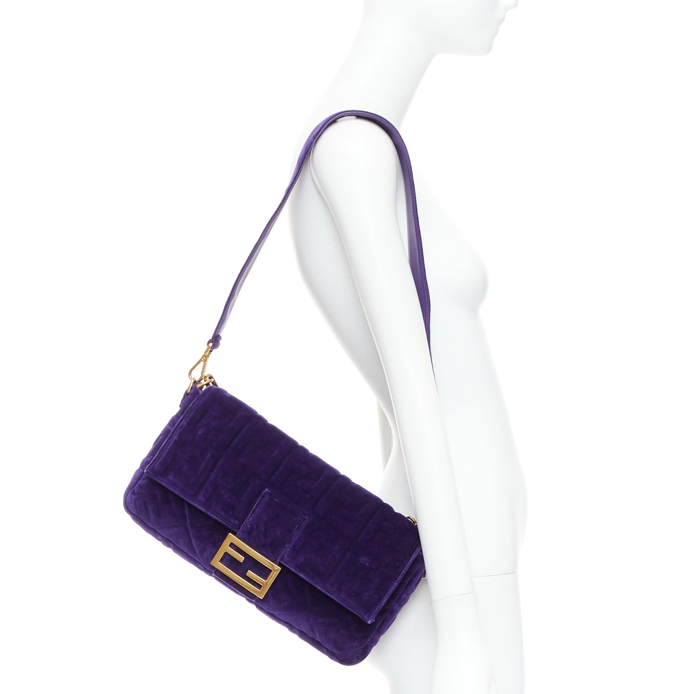 FENDI Baguette Viola Plus Vellto FF embossed purple velvet crossbody bag
Reference: TGAS/E00472
Brand: Fendi
Model: Velluto FF Embossed Baguette
Material: Velvet
Color: Purple, Gold
Pattern: Solid
Closure: Snap Buttons
Lining: Black Fabric
Extra