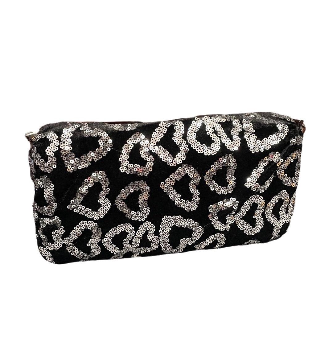 FENDI Baguette White Heart Shaped Sequin Black Shoulder Bag
 These are professional photos of the actual bag offered by Luxbags.
 This FENDI Baguette is a stunning piece, featuring hand-sewn heart-shaped white sequins on black velvet. This design