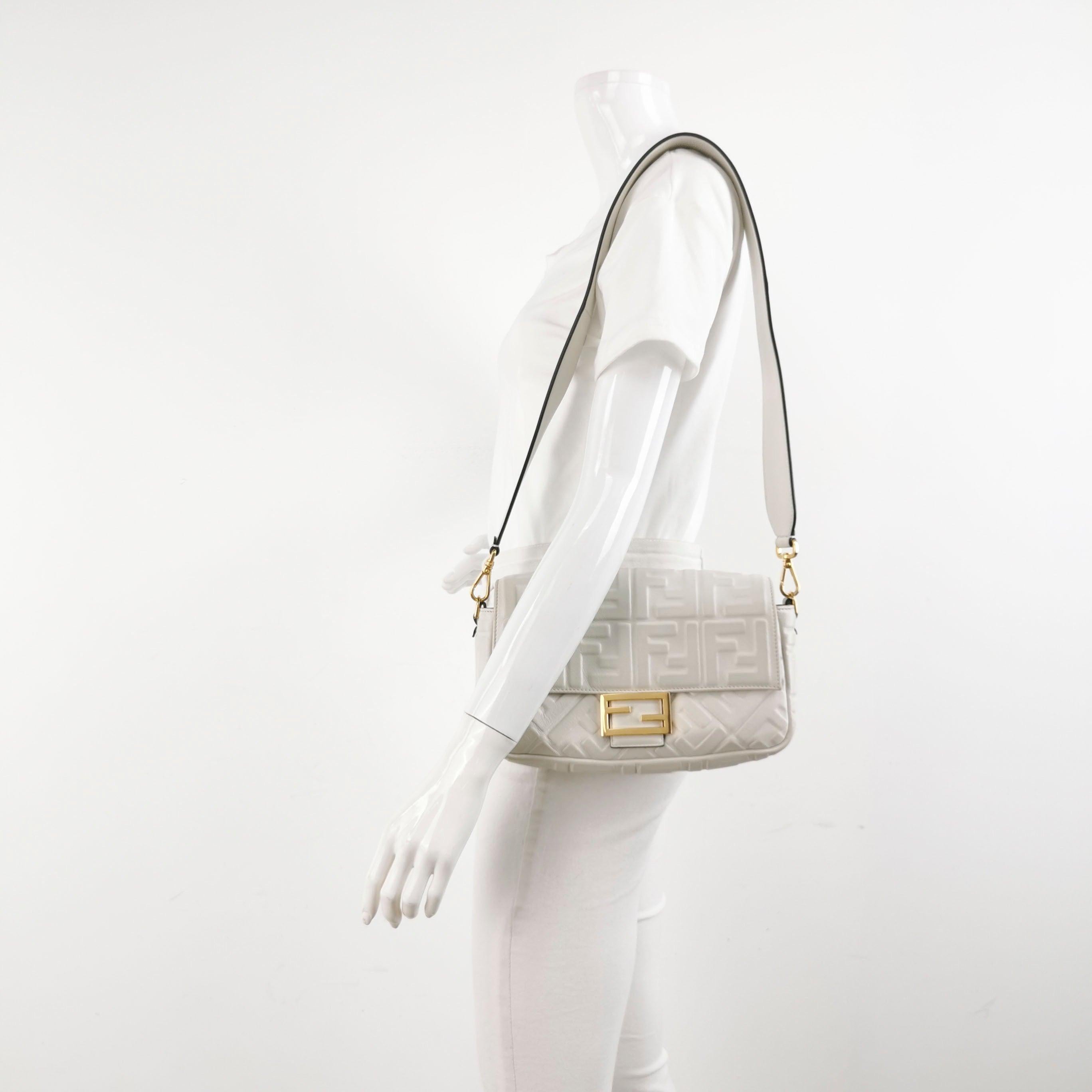 Fendi Baguette White Lambskin Leather Crossbody Bag Medium
These are professional photos of the actual bag.
Experience luxury and style with the Fendi Baguette in luxuriously Nappa Leather Crossbody Bag. Crafted from soft nappa leather with