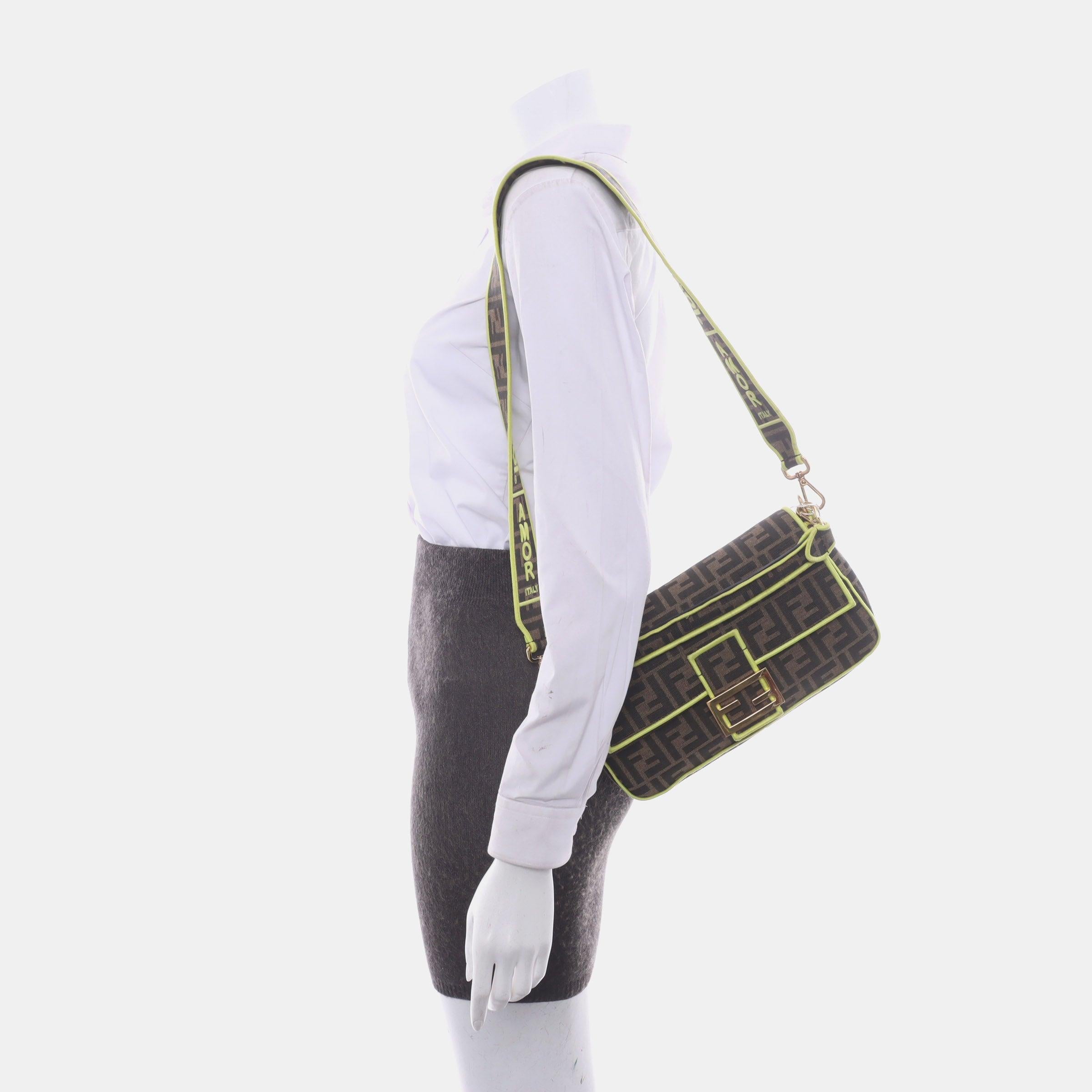 FENDI Baguette Zucca Monogram Canvas with Lime Neon Trimming Medium
 These are professional photos of the actual bag offered by Luxbags.
 Fendi Baguette in Brown Zucca print canvas with electrifying neon color trimming. 
 CONDITION: EXCELLENT
 Light