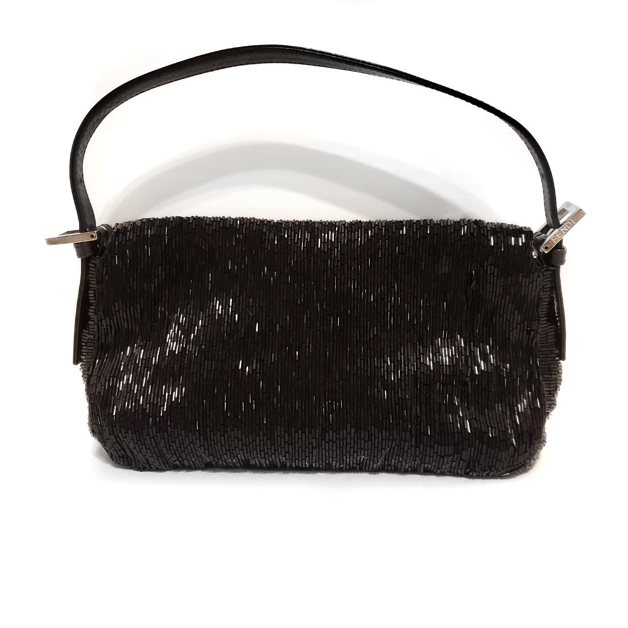 Brand - Fendi
Collection - Beaded
Estimated Retail - $2,400.00
Style - Baguette
Material - Leather Trimmed
Color - Black
Closure - Snap
Hardware Material - Silvertone
Comes With - Dustbag
Size - Small
Feature - Inner Pockets
Accent - Beaded
Product