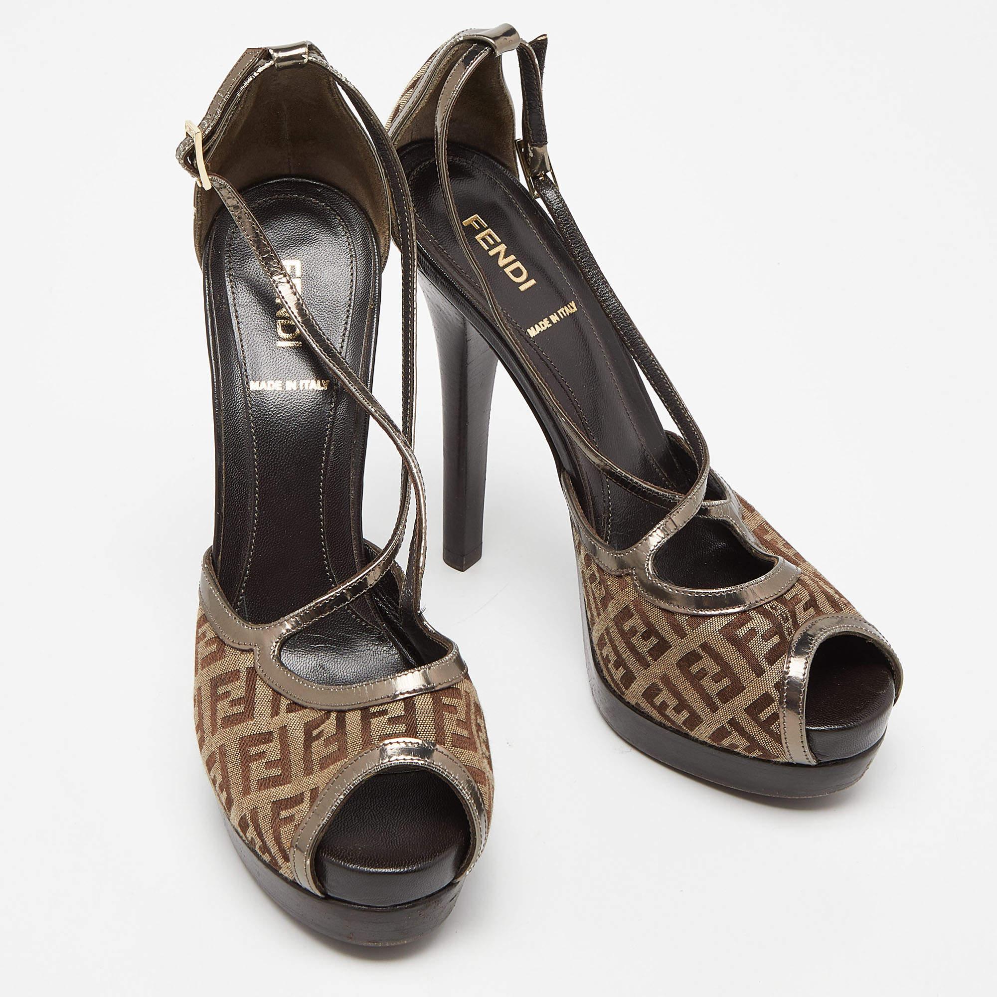 Bring out the diva in you in this fancy platform sandals from Fendi. Made in Italy, this Fendi Zucchino peep-toe pair has a canvas exterior, gold-tone lining, and prints of the signature logo of the Italian fashion house. Make every step stylish