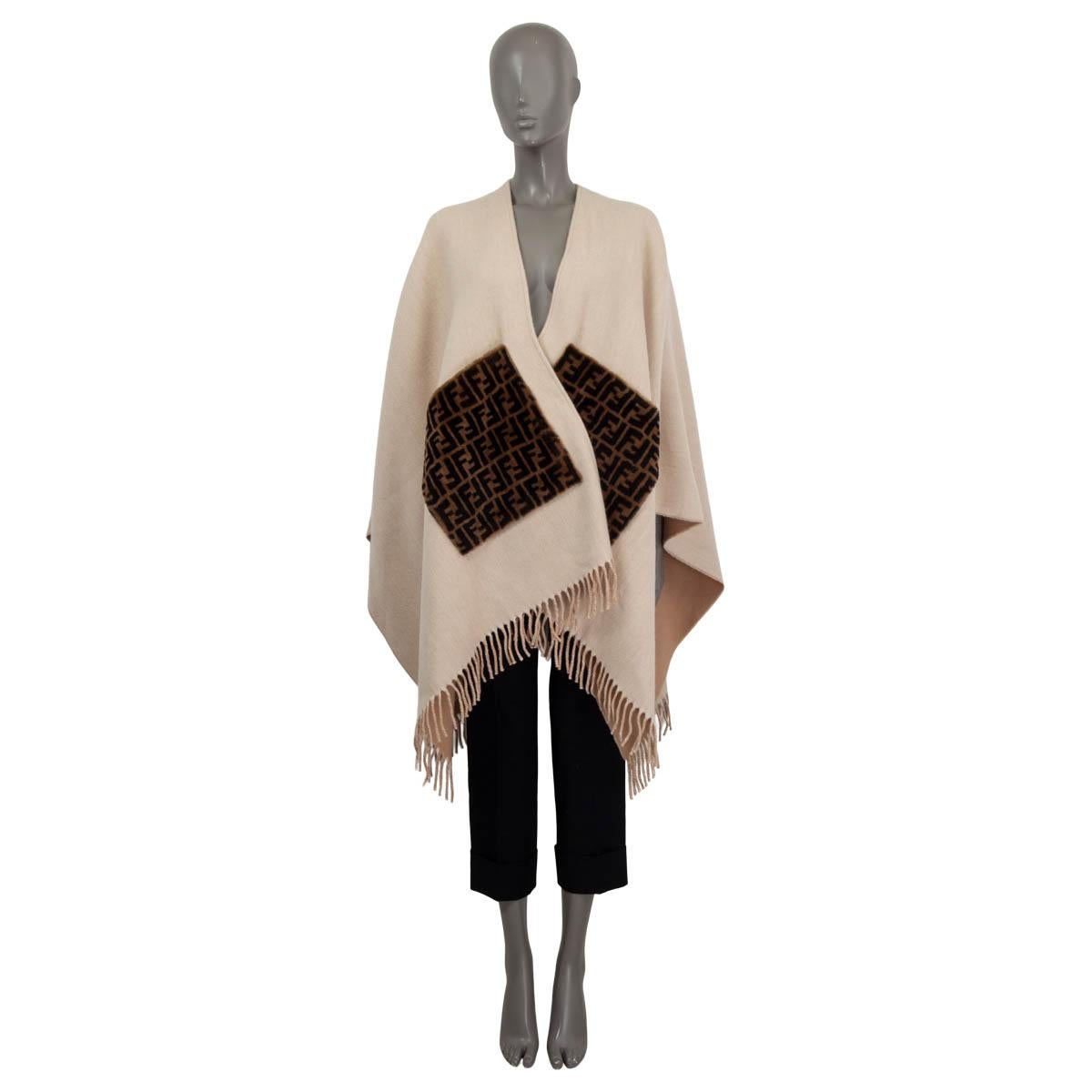 100% authentic Fendi 2022 fringed cape in beige cashmere (assumed because tag is missing). Features two logo shearlling patch pockets on the front. Unlined. Has been worn once and is in virtually new condition.

Measurements
Tag Size	One