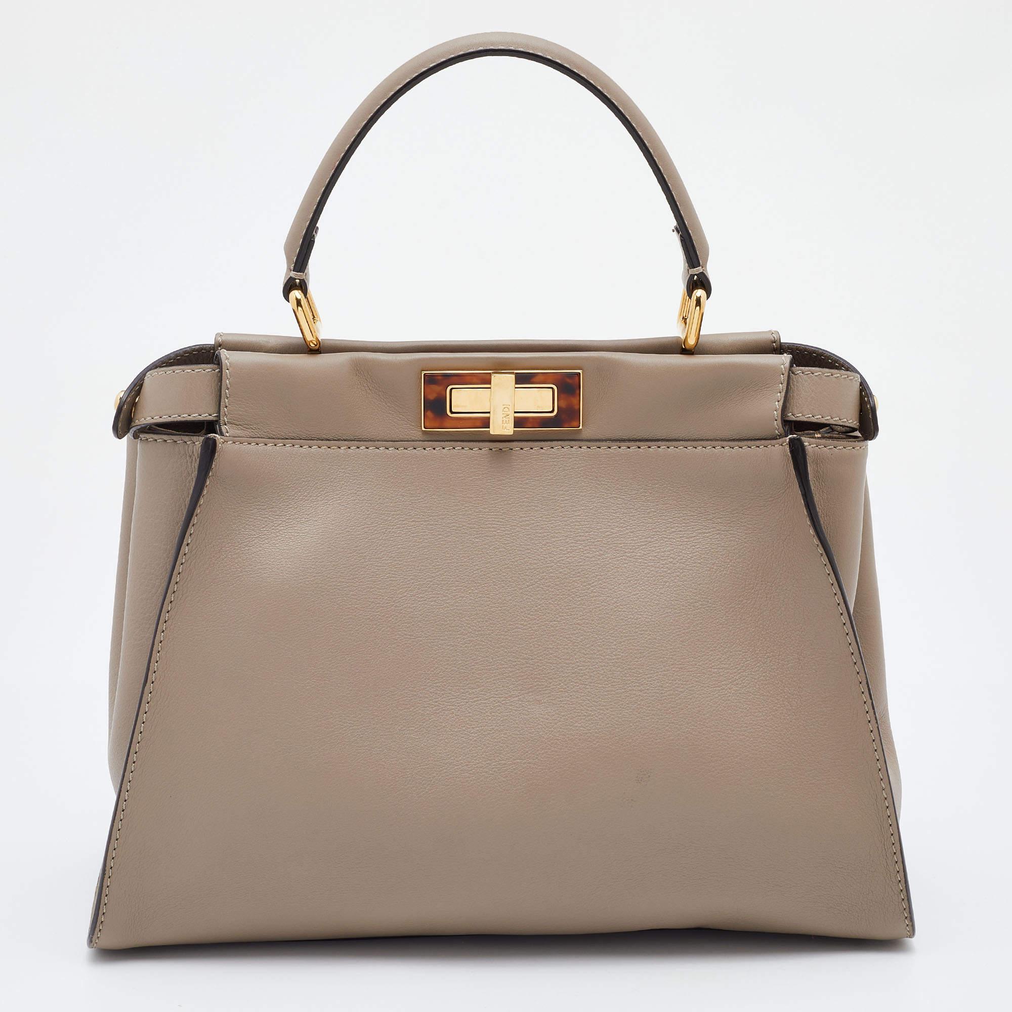 Designed by Venturini Fendi, the Peekaboo first debuted in 2008. The unique construction and representation of this bag enable it to keep up with fashion's ever-changing tide. Constructed from leather, it is complemented with plexiglass, gold-tone