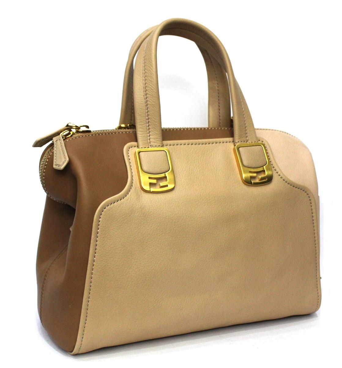 Chameleon Fendi bag made of brown and beige leather with golden hardware.

Equipped with leather handles and adjustable shoulder strap. Zip closure, internally capacious.

The bag is in excellent condition.