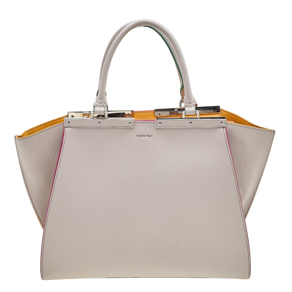 Fendi's 3Jours tote is one of the most iconic designs from the label and continues to gain popularity globally. This version is made from beige leather, which is embellished with silver-toned hardware. It has dual handles and a spacious