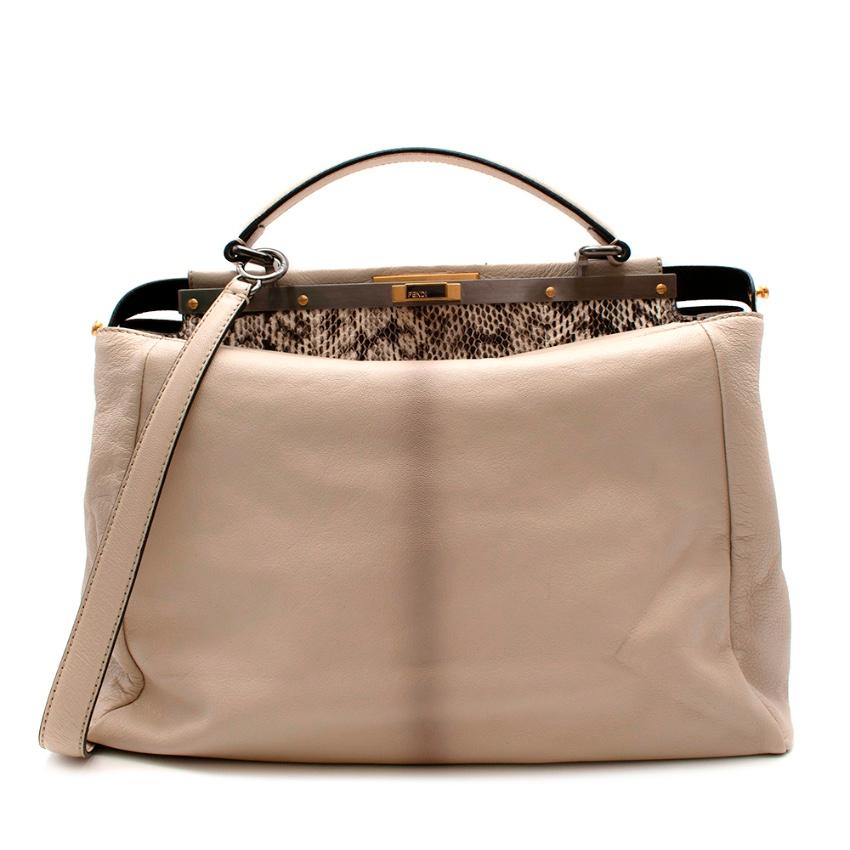Fendi Beige Leather Large Peekaboo Top Handle Bag

-Composed of two compartments, both fastened with the iconic Peekaboo twist lock
-The stiff partition is lined with snakeskin and has a zipped pocket
-Single handle and short detachable shoulder