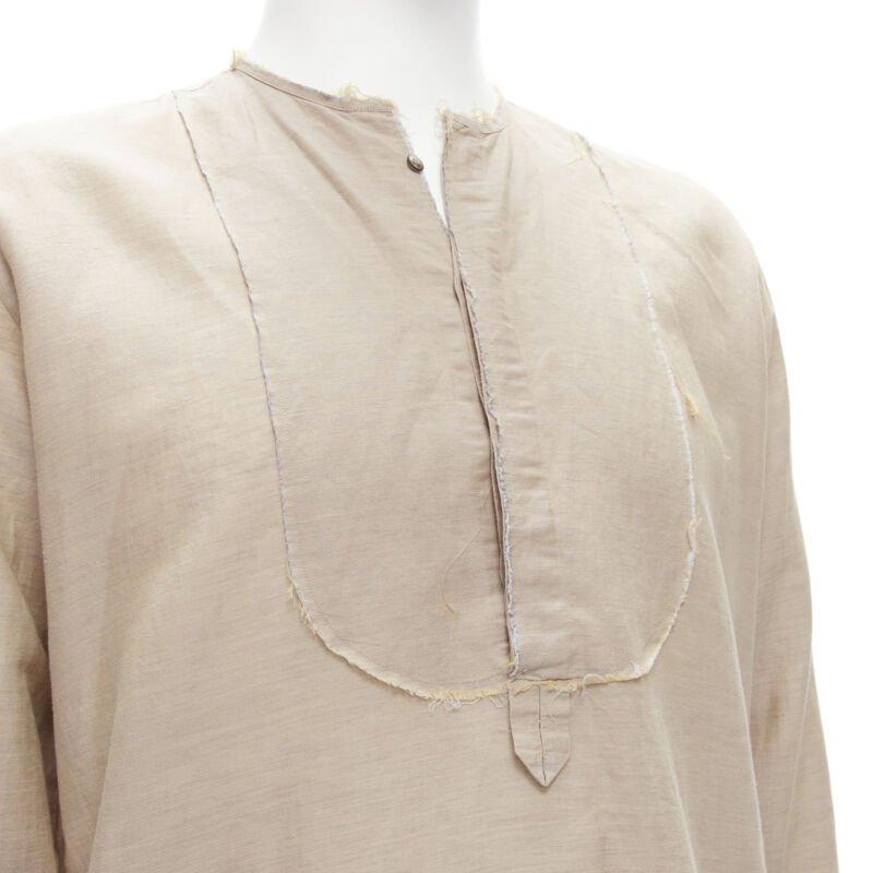 FENDI beige linen cotton raw frayed half button long sleeve shirt EU40 L
Reference: CNLE/A00173
Brand: Fendi
Material: Linen, Cotton
Color: Beige
Pattern: Solid
Closure: Button
Extra Details: Button collar. Raw frayed trim. Dual side pockets.
Made