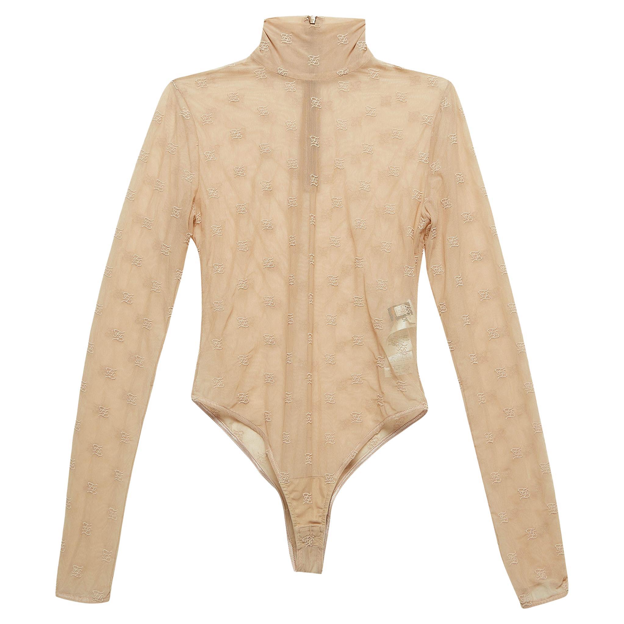 The designer bodysuit exudes elegance with its soft, finely woven fabric. The form-fitting silhouette seamlessly blends comfort and style, featuring an embroidered pattern.

