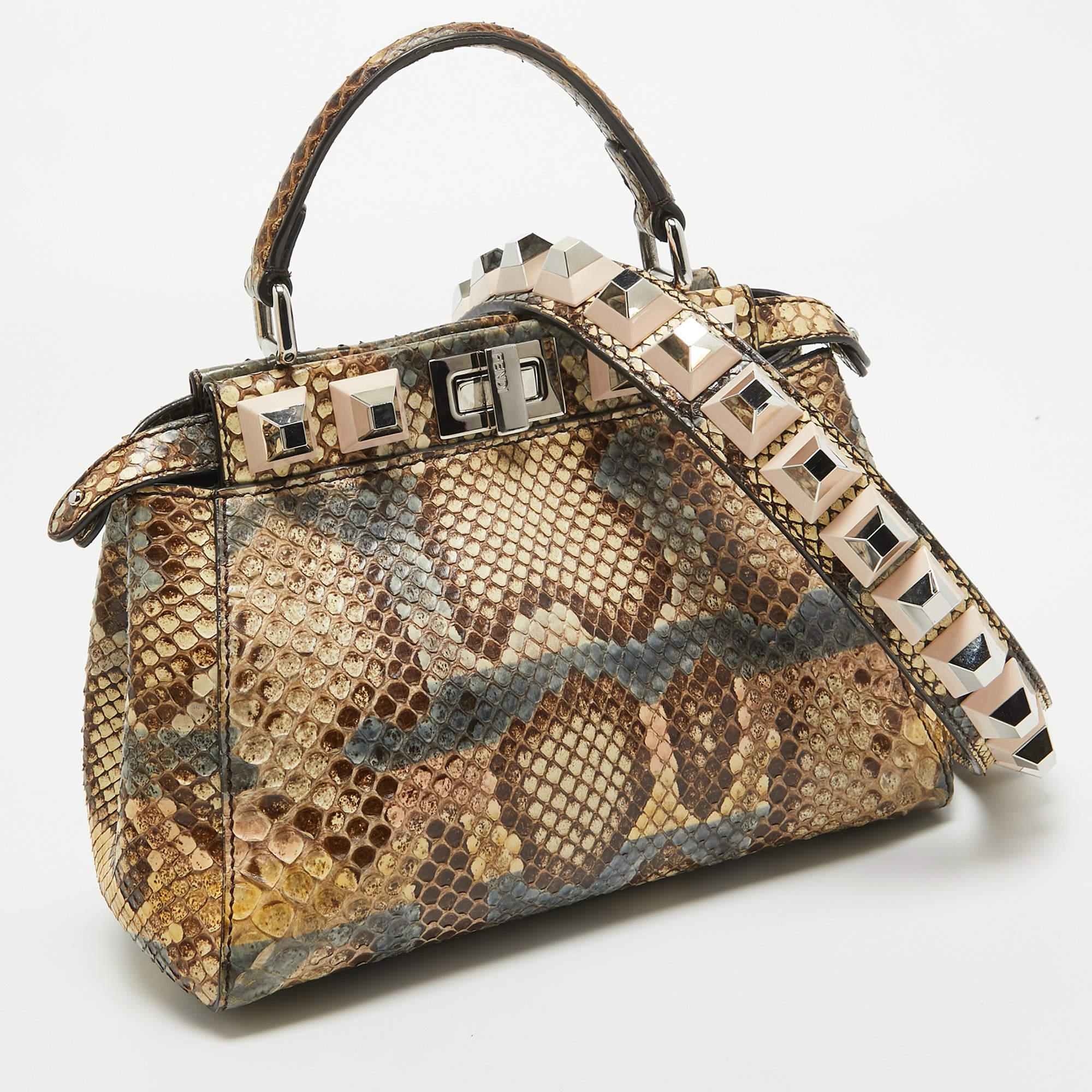 Designed by Venturini Fendi, the Peekaboo was first debuted in 2008. The unique construction and representation of this bag enable it to keep up with fashion's ever-changing tide. Constructed from python skin, it is complemented with silver-tone