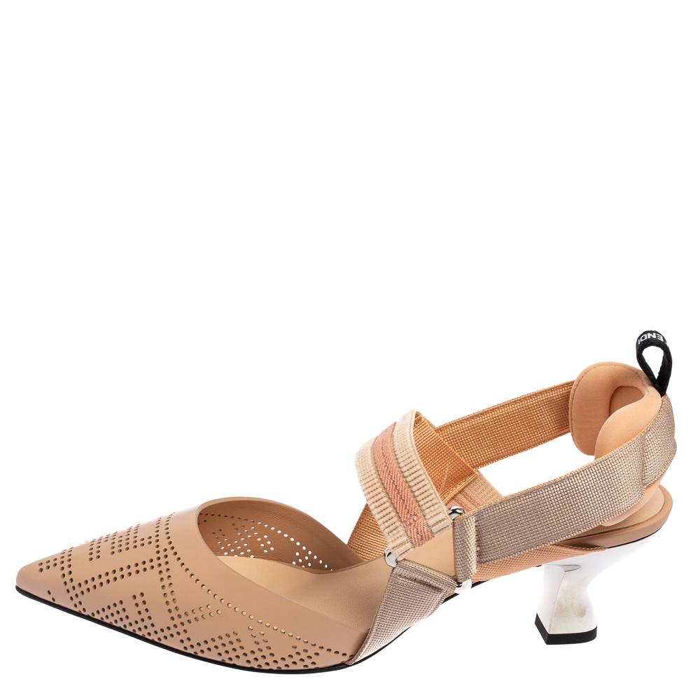 Look absolutely extraordinary in these slingback Colibri sandals from Fendi. Their exterior displays beige perforated leather with pointed-toes and heels. Additionally, their counters are provided with cushioning support. Wear these sandals and look