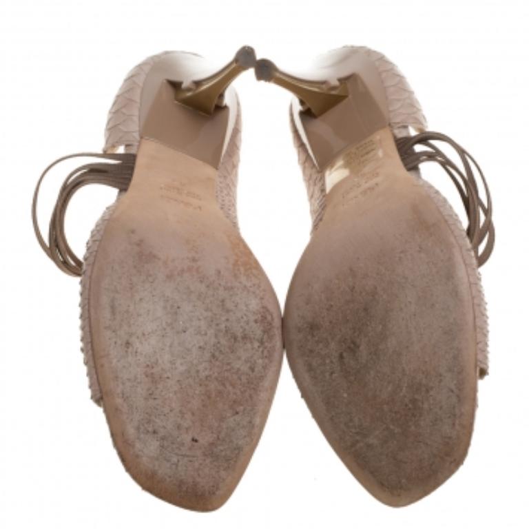 The D'Orsay classic silhouette gets a modern update in these Fendi pumps. Crafted from python-embossed leather, they feature peep-toes and stylish straps across the vamps. These sandals are elevated on 10.5 cm heels and look chic when you flaunt