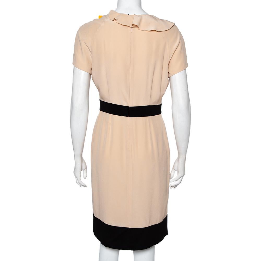 This beige-hued midi dress is from the house of Fendi. This dress wins with its feminine design of a flattering neckline, ruffle detailing and a sleek silhouette. The belt detail fine-tunes the otherwise simple design.

