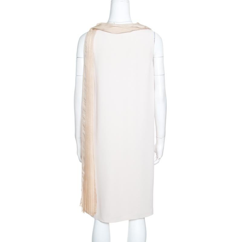 Make all jaws drop with this luxurious piece from the house of Fendi. Comfortable and stylish, this silk item is a must-have masterpiece in any fashionista's collection. This captivating beige piece has a pleated scarf neck detail and it will look